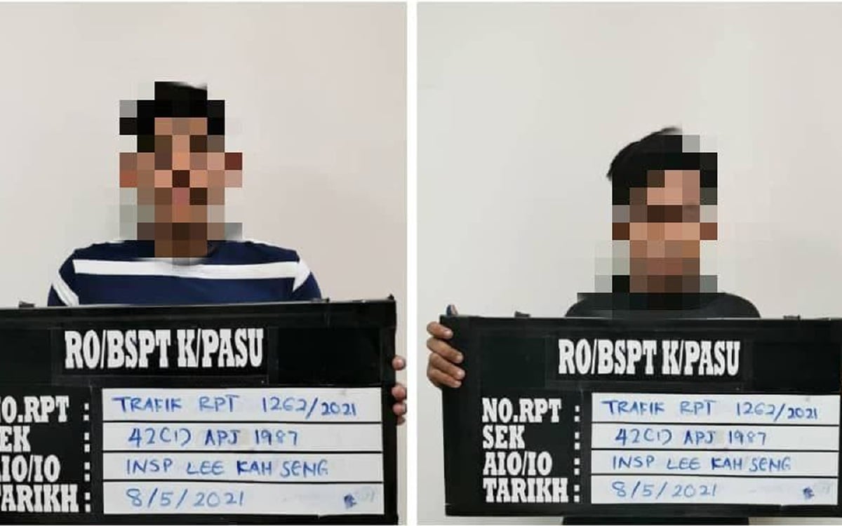 Dua remaja lelaki berusia 17 dan 18 tahun yang ditahan polis kerana melakukan aksi wheelie di hadapan lampu isyarat Taman Tunku Maheran. FOTO IHSAN PDRM