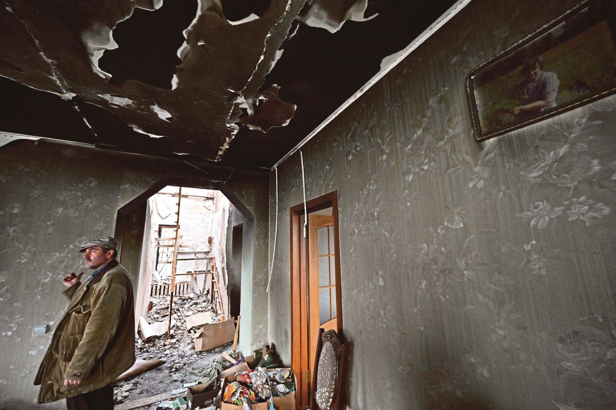 KESAN kerosakan akibat perang di Bucha. FOTO AFP 