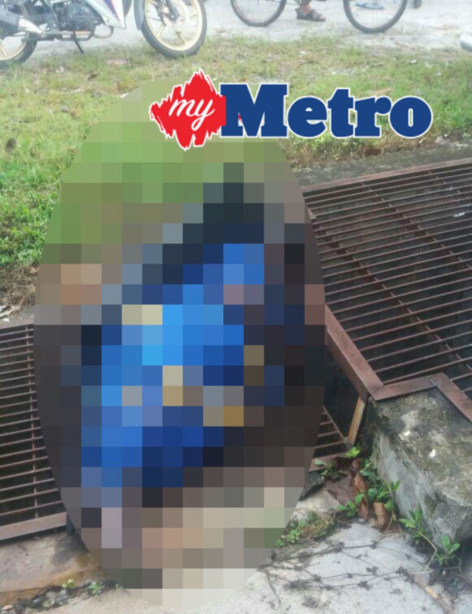 Mayat M Muniamah ditemui di tepi jalan. FOTO ihsan PDRM