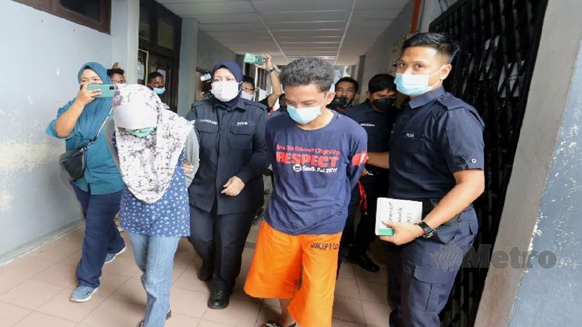 SUAMI isteri didakwa di Mahkamah Majistret Ipoh kerana menyebabkan kematian kanak-kanak perempuan berusia lapan tahun. FOTO L Manimaran