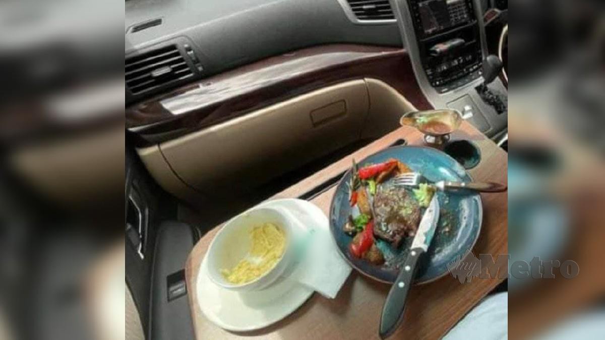 LAYANAN 'dine-in' di dalam kenderaan yang disediakan oleh premis makanan adalah melanggar SOP. FOTO Melvin Joni