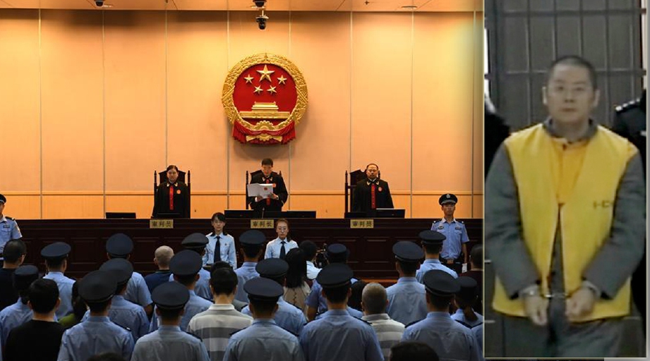 Perbicaraan 26 defendan kes skim cepat kaya Ponzi di Bejing, hari ini, termasuk Pengerusi Yucheng Holdings, Ding Ning (kanan) yang ditahan tahun lalu. - Foto Xinhua
