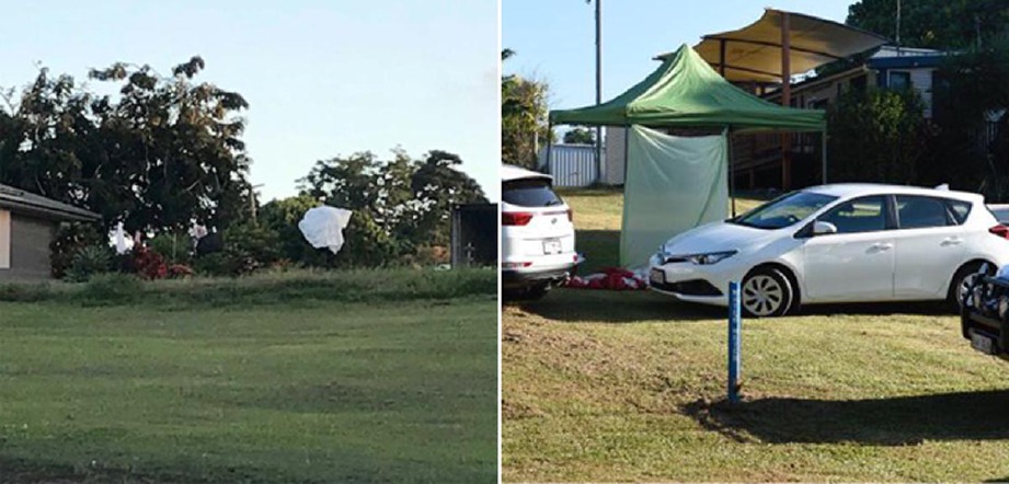 Payung terjun yang tersangkut pada pokok dan polis melakukan siasatan di tempat mayat seorang penerjun ditemui. -  Foto ABC/CairnsPost