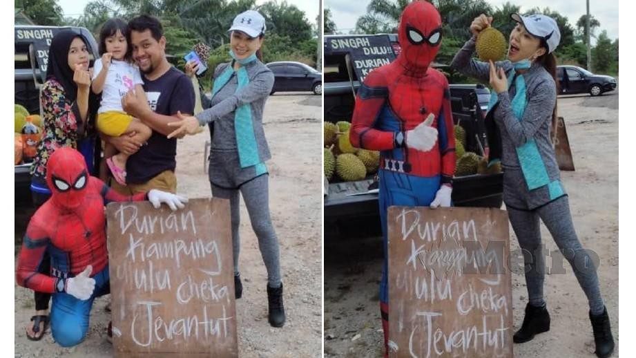 Penjual durian kampung, Mohd Rafiz Rosli, 33 dan  Mohd Azim Ahmad, 35, (depan) menggunakan kreativiti memakai costume 'spiderman' untuk menarik perhatian pembeli ketika menjual durian di Gambang. FOTO  ROSELAN AB MALEK