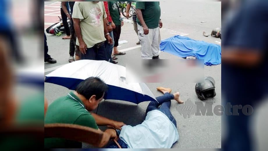 WANITA maut manakala anak perempuannya parah selepas motosikal ditunggang bertembung lori di Jalan Jelapang-Chemor berhampiran Taman Chepor Indah semalam. FOTO IHSAN PEMBACA