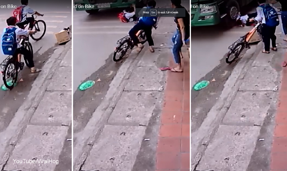 Petikan rakaman video budak sekolah hampir digilis lori di Hanoi, Vietnam.