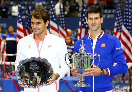 Djokovic (kanan) bersama trofi Terbuka Amerika Syarikat selepas menewaskan Federer. - Pix AFP 