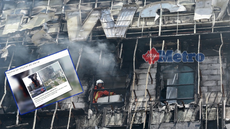 ANGGOTA bomba memeriksa kesan kebakaran pada bangunan KWSP, Petaling Jaya, hari ini. FOTO Sairien Nafis