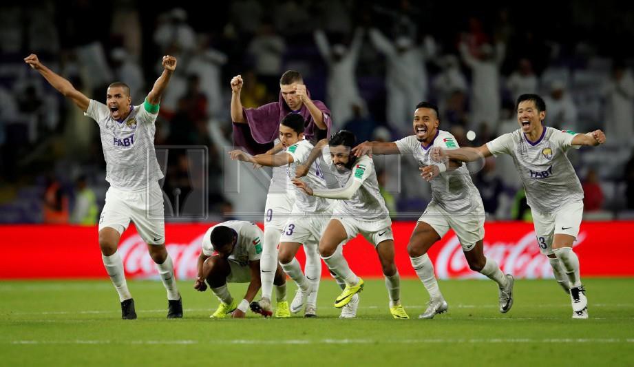 PEMAIN Al Ain meraikan kejayaan mereka mengalah Team Wellington. -Foto Reuters