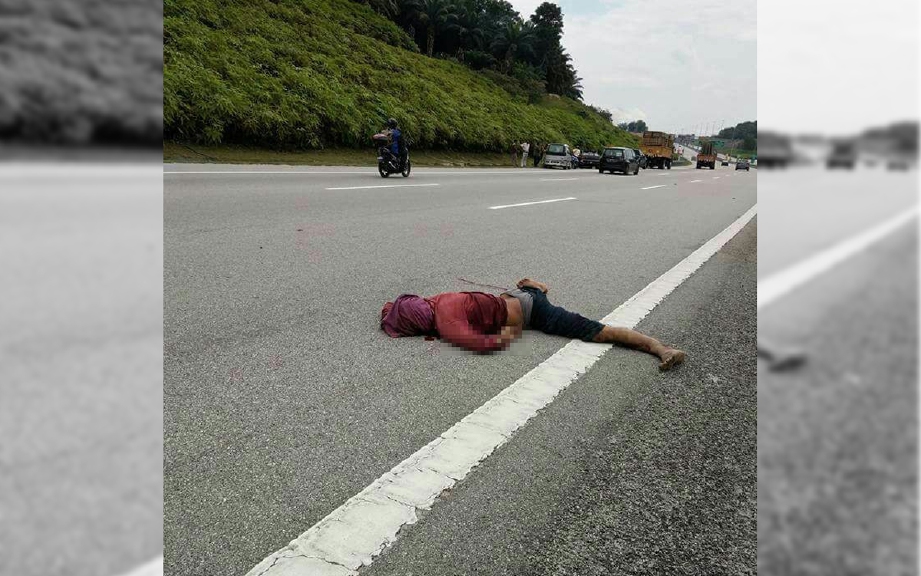 Mayat mangsa kemalangan yang terbaring di tepi lebuh raya. 