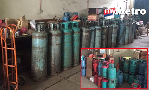 Antara tong gas bersubsudi dan industri yang ditemui dalam serbuan di di Kawasan Perusahaan Sri Kembangan, pagi tadi. - Foto NSTP
