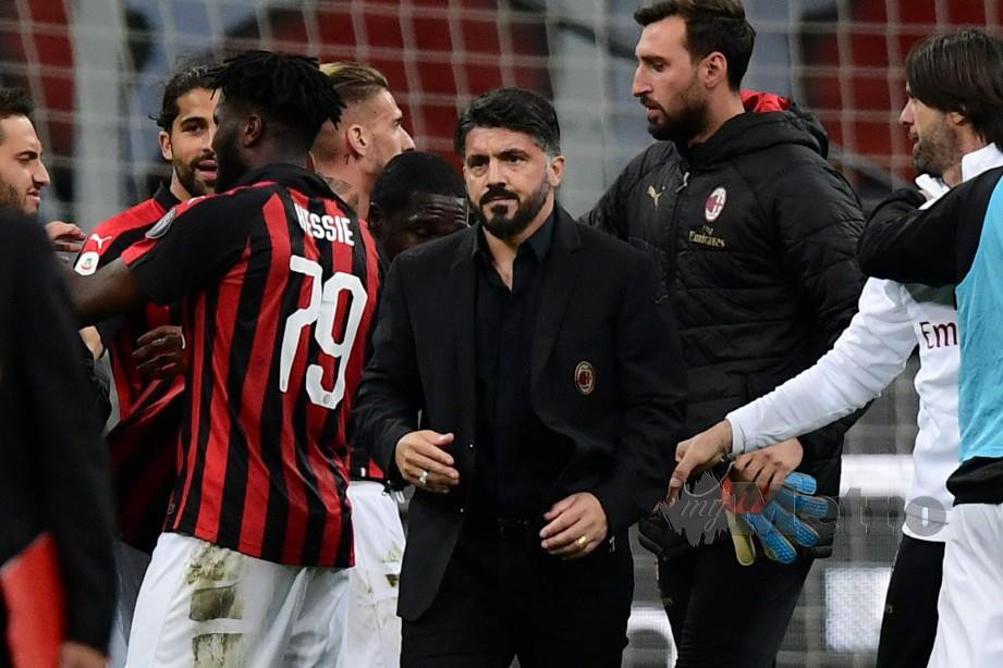 REAKSI Gattuso (tengah) selepas menang aksi Serie A, awal pagi tadi. — FOTO AFP