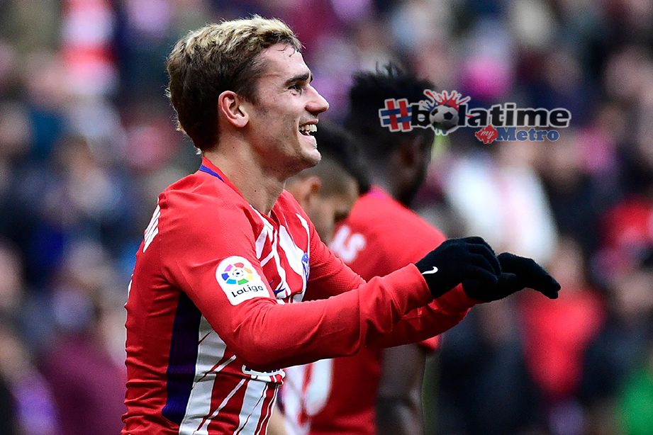 GRIEZMANN meraikan kejayaan selepas meledakkan gol ketika menentang Girona FC di Stadium Wanda Metropolitano. Foto AFP 