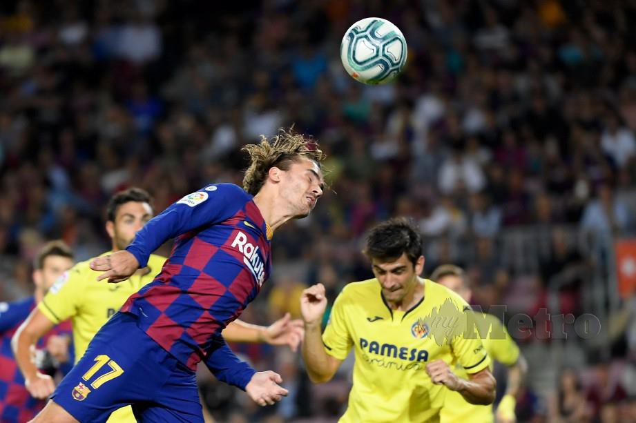PENYERANG Barca, Antoine Griezmann (tengah) menyumbang satu gol menentang Villarreal, awal pagi tadi. — FOTO AFP