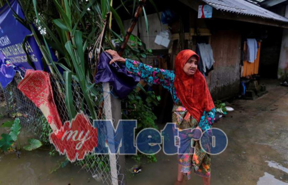 LIMAH Muda, 72, di halaman rumahnya di Kampung Kijing, Marang. FOTO Ghazali Kori