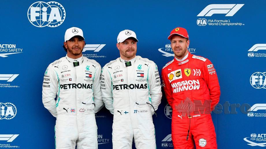 Bottas (tengah) bersama Hamilton (kiri) dan Vettel (kanan). FOTO REUTERS 