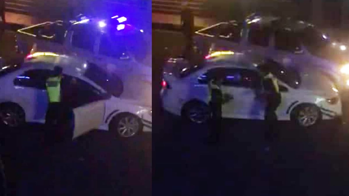 ANGGOTA polis berjaya menahan suspek yang memandu kereta Mitsubishi Lancer. FOTO ihsan Pembaca