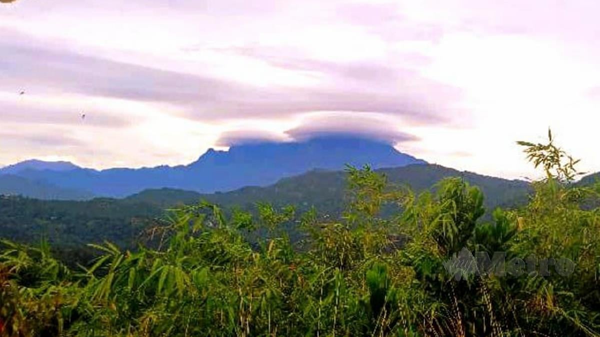 Gunung Kinabalu kelihatan seolah-oleh memakai serban petang tadi. - FOTO JOHARY INDAN