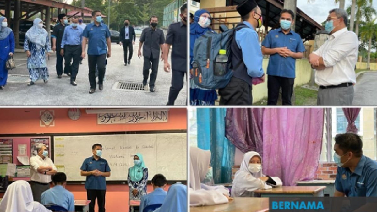 DATUK Dr Radzi Jidin melawat Sekolah Menengah Kebangsaan Dato' Abu Bakar Baginda, Sungai Merab Luar di Bandar Baru Bangi pada hari pertama pembukaan sekolah menengah untuk kumpulan B. FOTO Bernama