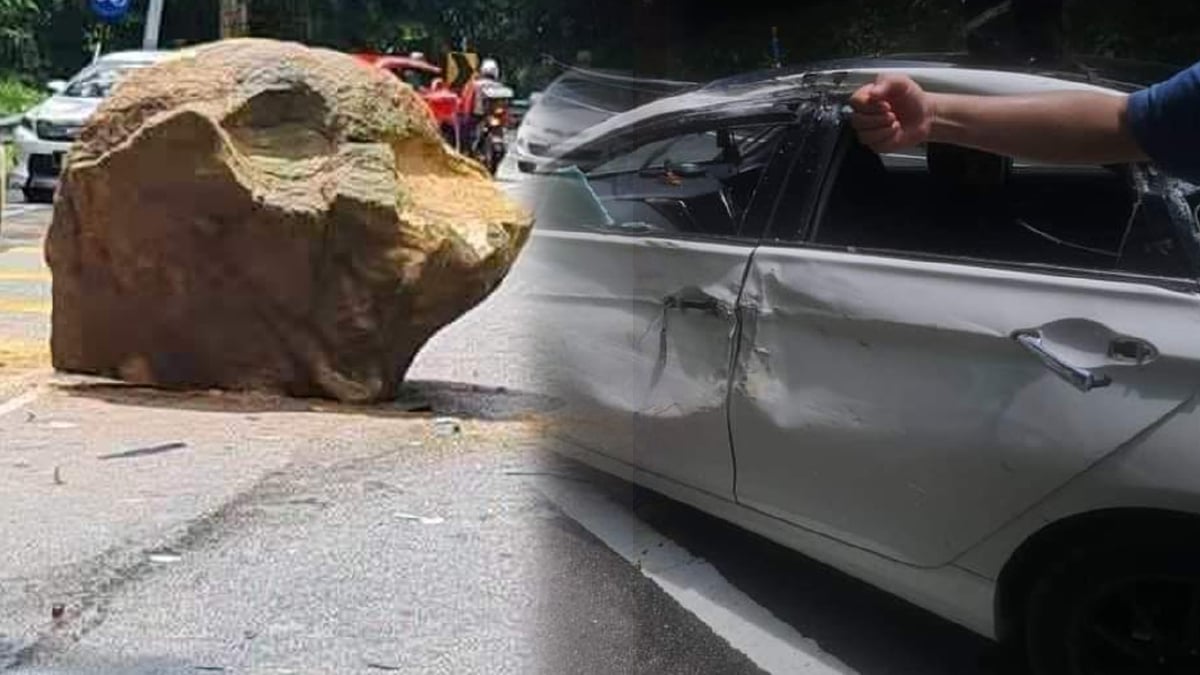 PEMANDU kereta nyaris maut apabila bongkah batu sebesar tiga pemeluk dewasa bergolek dari atas bukit. FOTO TULAR