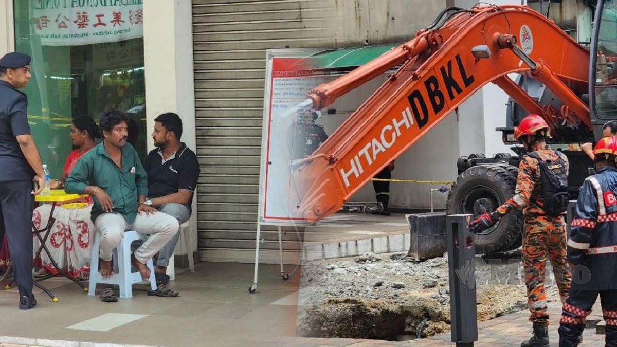 (Baju hijau) Suami mangsa menunggu pasukan penyelamat mencari isterinya. FOTO MOHD HARIS FADLI MOHD FADZIL