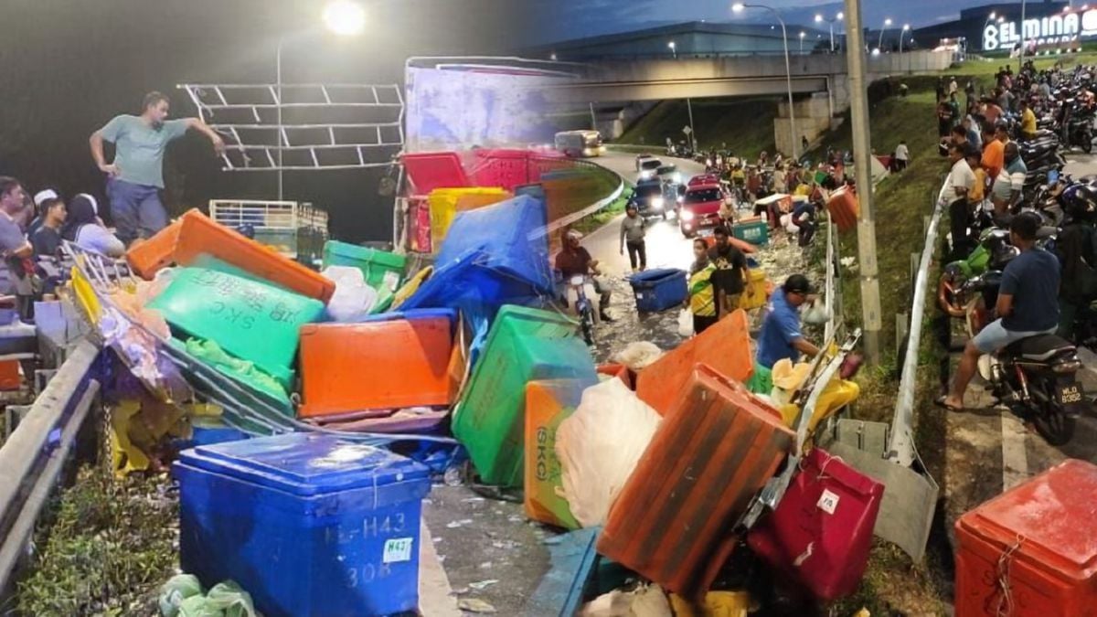 Lori membawa muatan hasil laut terjatuh di Jalan Kuala Selangor-Sungai Buloh, berhampiran kawasan Perindustrian Kota Elmina, Sungai Pelong, di sini, semalam akibat pagar pengangkut lori terbuka. FOTO IHSAN PDRM