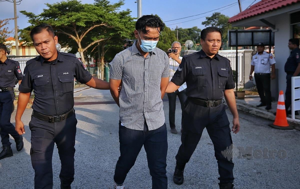 LELAKI yang videonya tular memukul isterinya selepas curang di sebuah hotel, Mohd Ridwan, dihadapkan ke Mahkamah Majistret Port Dickson. FOTO Azrul Edham