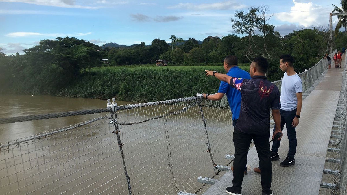 Lokasi mangsa dipercayai terjatuh dari Jambatan Gantung Kampung Damat - Kampung Lakang di Kampung Telibong, Tamparuli. FOTO IHSAN PDRM
