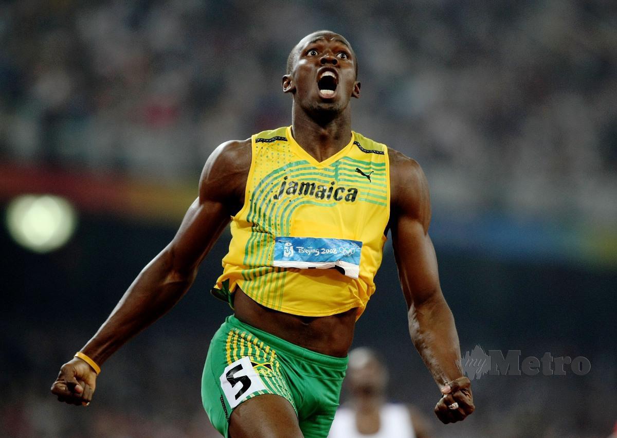Usain Bolt catat rekod dunia dalam acara pecut 100m. FOTO Agensi