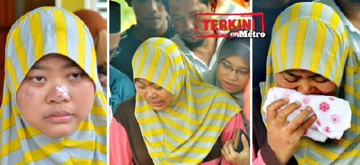 Pilu seorang ibu, Zuriyana Marsunit, yang terpaksa ditenangkan ahli keluarganya ketika pengebumian dua anaknya di tanah perkuburan Islam kampung Bukit Badong, Kuala Sekangor, pagi tadi. - Foto FAIZ ANUAR