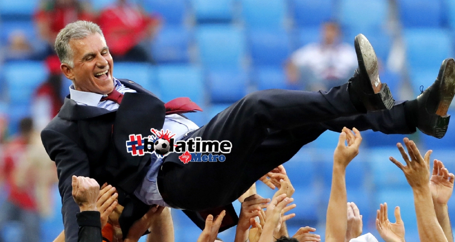 Queiroz dijulang oleh pemainnya selepas skuad Iran menewaskan Maghribi. FOTO Agensi 