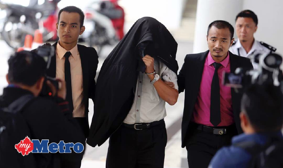 Raymond dihadapkan ke Mahkamah Sesyen Kota Kinabalu atas dakwaan salah guna kuasa. FOTO Malai Rosmah Tuah