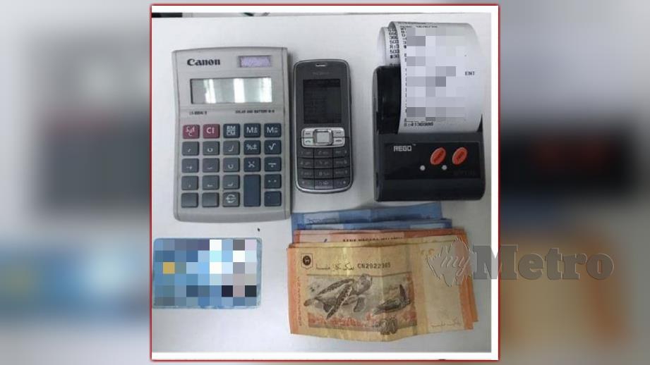Antara barangan termasuk wang tunai yang dirampas dalam Op Dadu. FOTO Ihsan PDRM