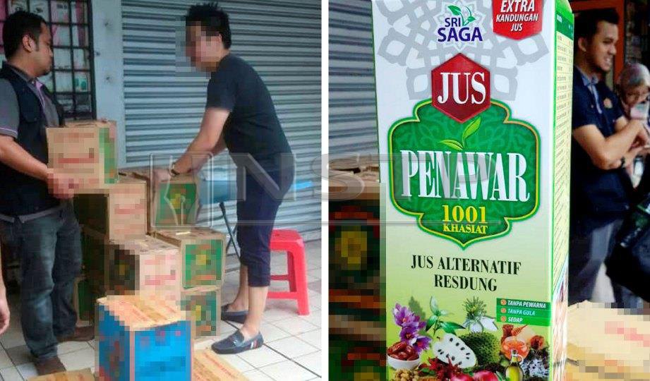 ANGGOTA  penguat kuasa  merampas produk  minuman kesihatan Jus Al Sunnah, Jus Al Sunnah Gold dan Jus Penawar yang  masih bebas  dijual di sekitar  Jalan Raja Bot, kelmarin. FOTO NSTP
