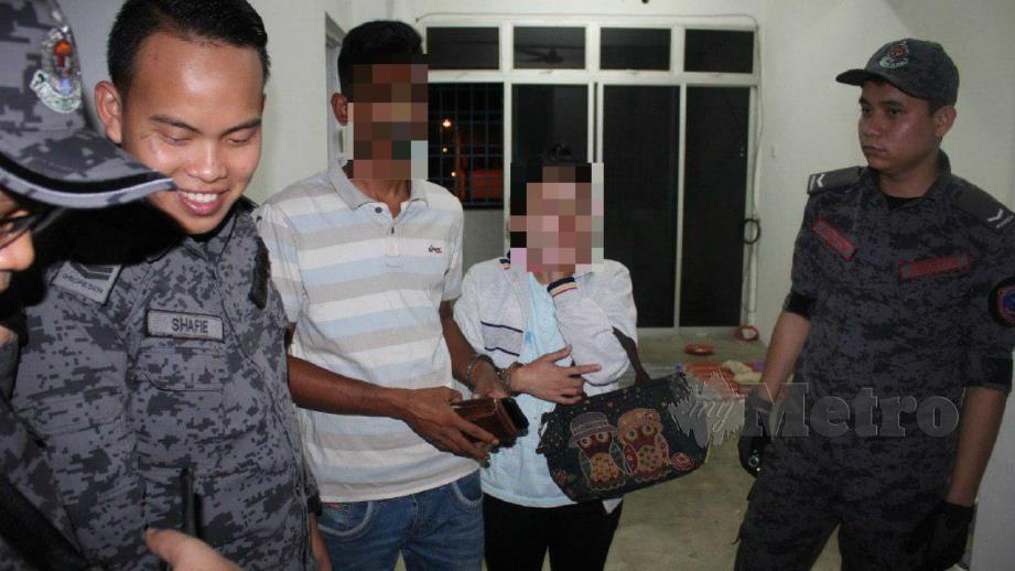 PASANGAN warga asing yang juga PATI diberkas Jabatan Imigresen (JIM) Pulau Pinang ketika sedang bercumbu. FOTO Ihsan JIM