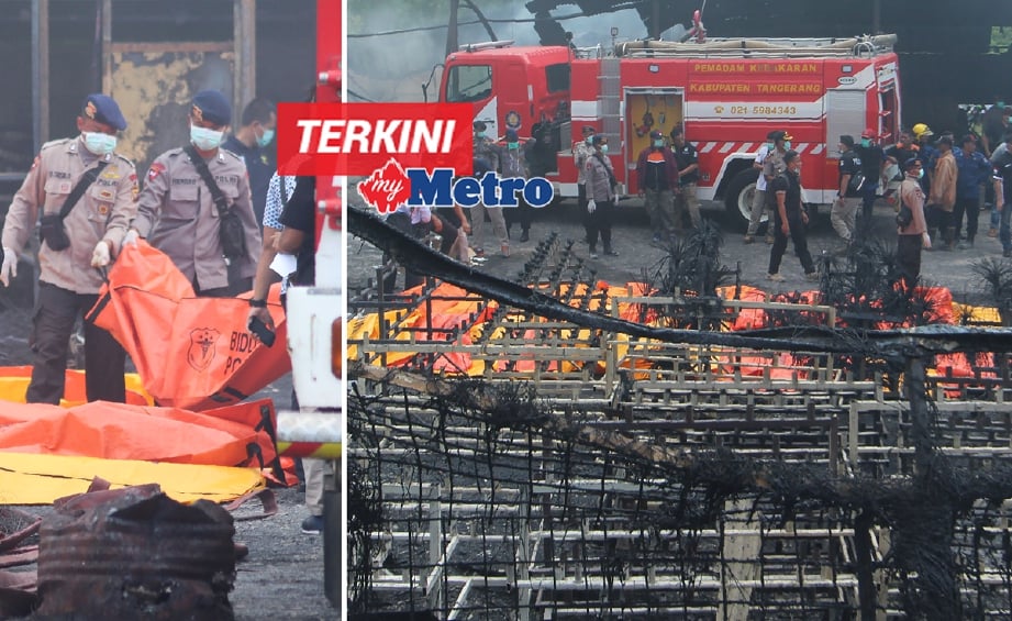 Anggota pasukan forensik polis Indonesia memeriksa mayat mangsa kebakaran kilang bunga api di Tagerang, Jakarta, sebelum dibawa ke hospital, hari ini. - Foto AFP