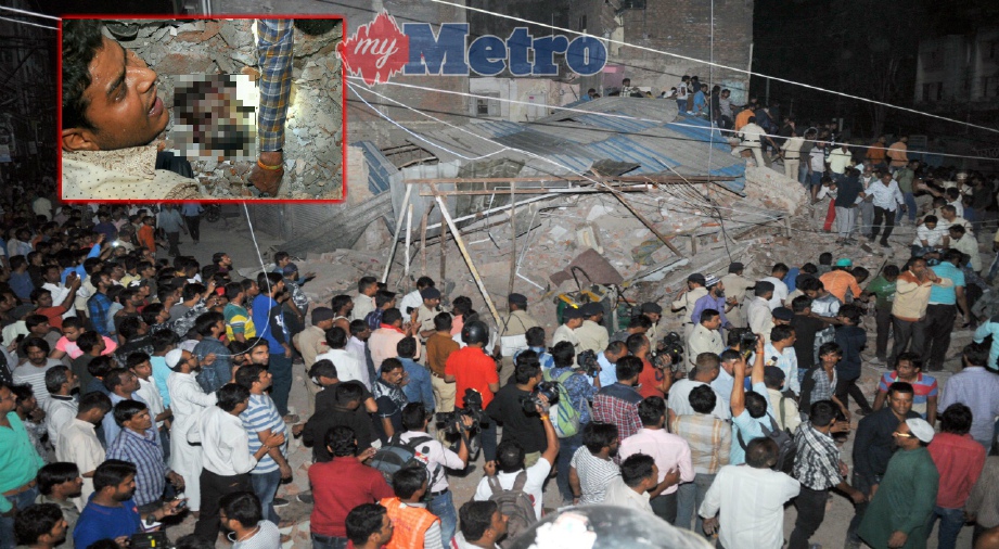PENDUDUK mengerumuni lokasi bangunan runtuh di Indore, New Delhi, semalam. Keadaan lelaki yang ditemui di bawah runtuhan bangunan dalam operasi menyelamat (gambar kecil). Foto AFP