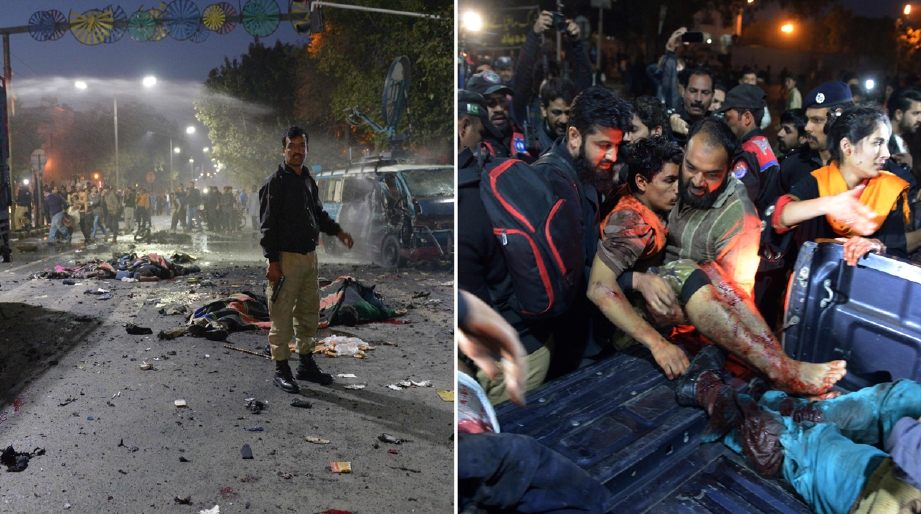 Anggota polis mengawal lokasi serangan berdekatan mayat mangsa selepas penyerang nekad meletupkan bom bersama dirinya di Lahore. - Foto AFP