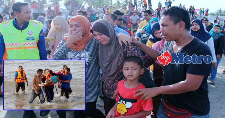 Fatihah (tengah) ditenangkan ahli keluarga selepas mayat Muhammad Shahir (gambar kecil) ditemui oleh sepasukan anggota Pasukan Penyelamat Di Air (PPDA) bersama nelayan di Pantai Sabak, hari ini. Foto NIK ABDULLAH NIK OMAR