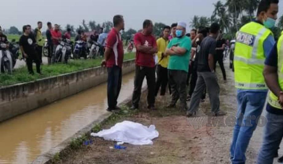 KANAK-KANAK lelaki ditemui lemas selepas terjatuh ke dalam tali air di Jalan Permatang Sungai, Kampung Pokok Simpor, Kepala Batas, hari ini. FOTO ihsan bomba. 