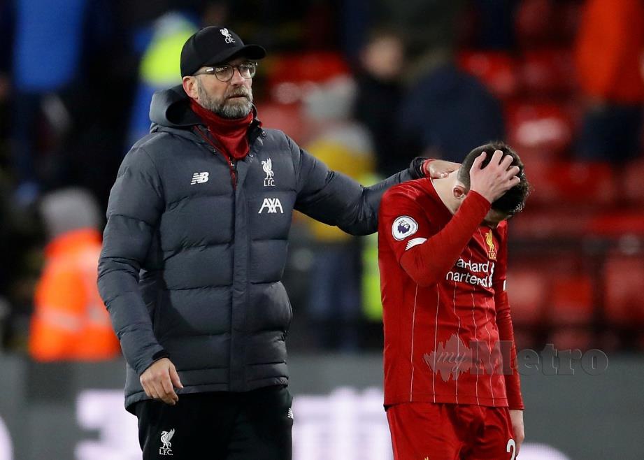 REAKSI Pengurus Liverpool, Juergen Klopp (kiri) dan Andrew Robertson pada saingan liga sebelum ini. FOTO Reuters