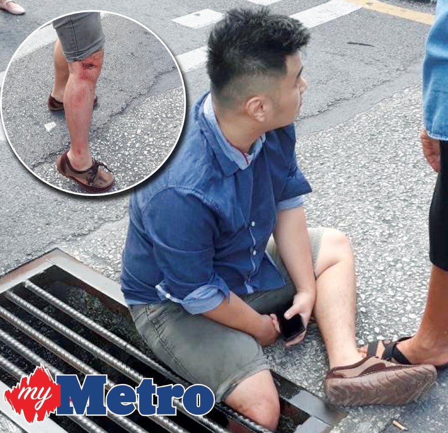 SALAH seorang mangsa yang tersepit  kakinya didalam ‘besi jerlus’ akibat kerosakkan  penutup longkang di Jalan Chia Tze Chin, Miri. -Foto IHSAN PEMBACA