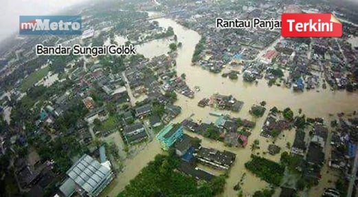 GAMBAR dari atas menunjukkan pekan Rantau Panjang (atas) dan pekan Sungai Golok, Thailand (bawah) yang ditenggelami air sejak semalam. IHSAN warga Thailand, Padung Wanalak.