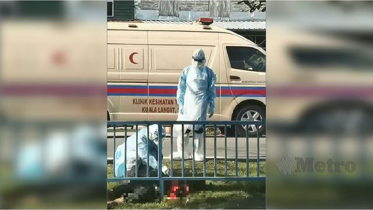 RAKAMAN video yang tular di laman sosial memaparkan pasukan perubatan melakukan pemeriksaan terhadap lelaki yang meninggal dunia. FOTO tular