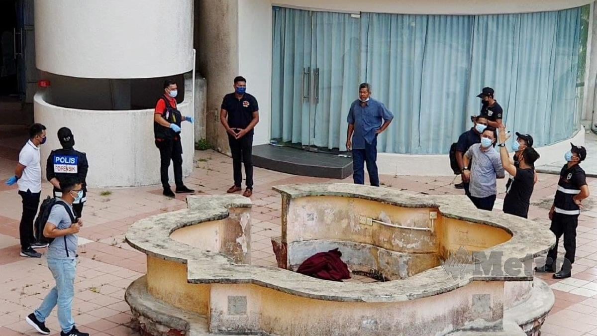 Anggota forensik PDRM menjalankan siasatan di lokasi kejadian penemuan mayat kanak-kanak perempuan dipercayai terjatuh dalam kejadian di sebuah hotel di Tanjung Bungah hari ini. FOTO MIKAIL ONG