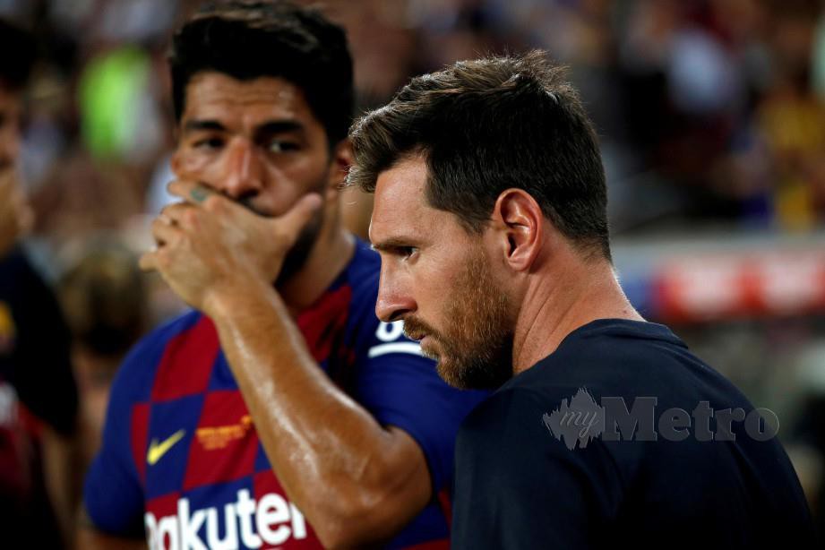 Lionel Messi (kanan) bersama Luis Suarez tonggak serangan Barcelona. FOTO Agensi 