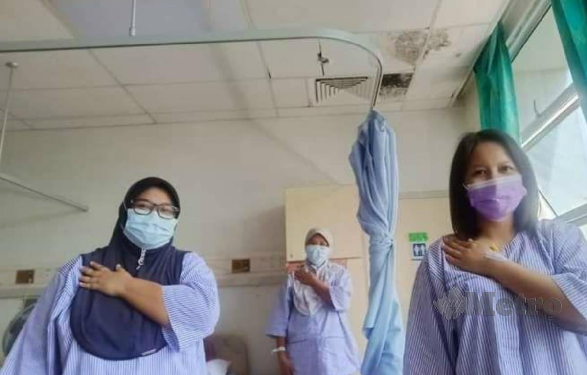SITI Nurjannah (kiri) dikuarantin di wad Hospital Lahad Datu bersama dua jururawat lain.