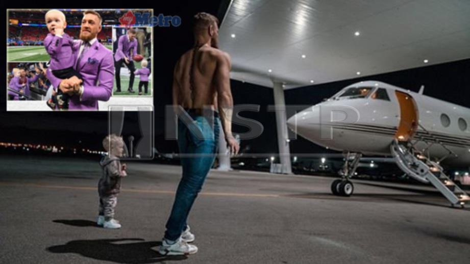 Conor bersama anaknya di hadapan jet peribadi mereka. FOTO Instagram the notorious mma/REUTERS