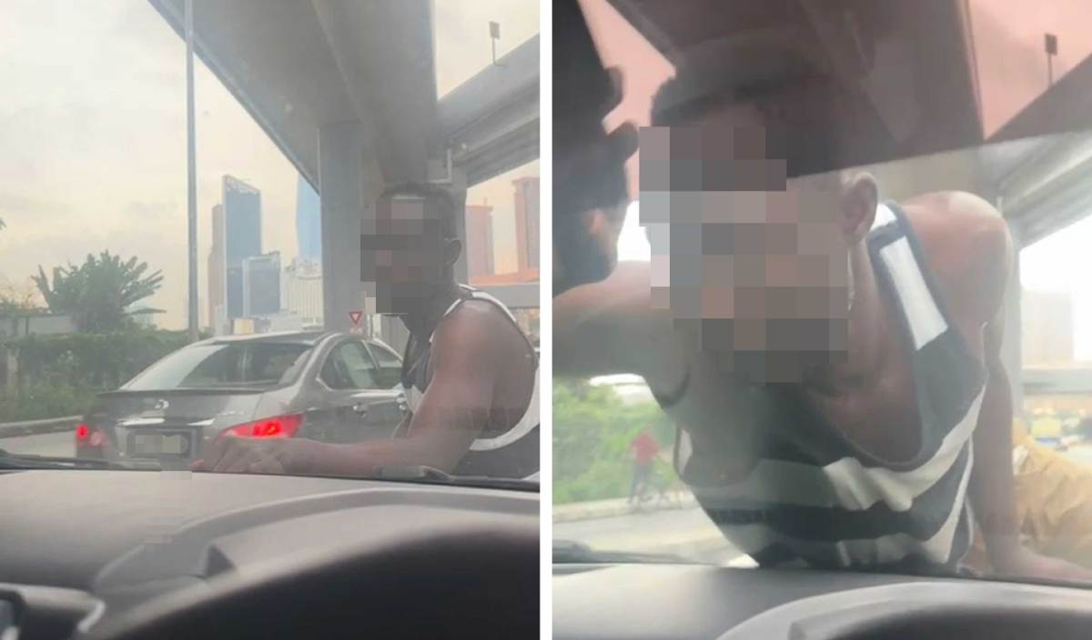 TANGKAP layar video lelaki warga asing tidak dikenali tiba-tiba naik ke bonet kereta Tazliana di Bulatan Pandan. FOTO Ihsan Tazliana Musa