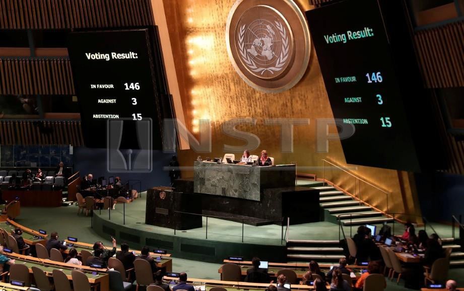 Vote tallies are shown by members of the United Nations General Assembly on whether to allow the Palestinians to procedurally act like a member state during meetings in 2019 when they will chair the group of 77 developing nations at the United Nations in New York, U.S., October 16, 2018. REUTERS/Shannon Stapleton